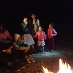 Mongolian children singing at the campfire.