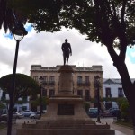 Sucre Square Statue in front of Building