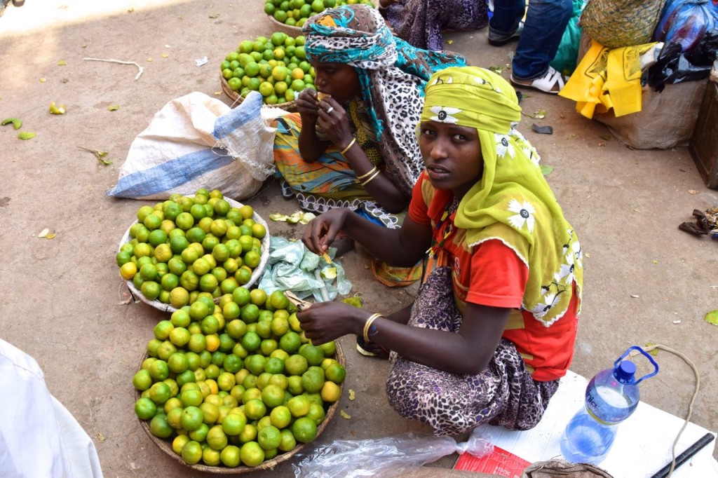A girl sells fresh limes at the Smuggler's Market.