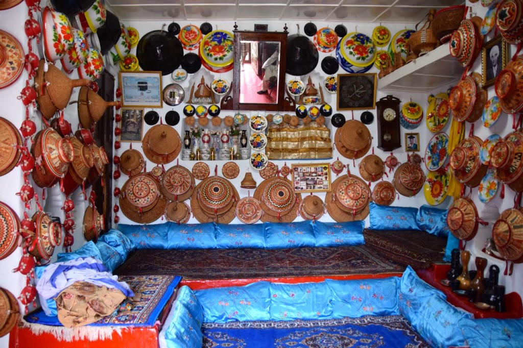 Traditional home with ceremonial items decorating the walls. 